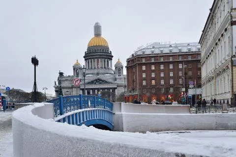 The blue bridge on the Moika river, on the background of St. Isa Stock Photos