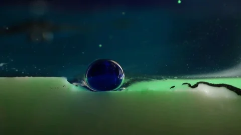 Blue Bubble Pops on Surface of Green Liquid Stock Footage 75486230