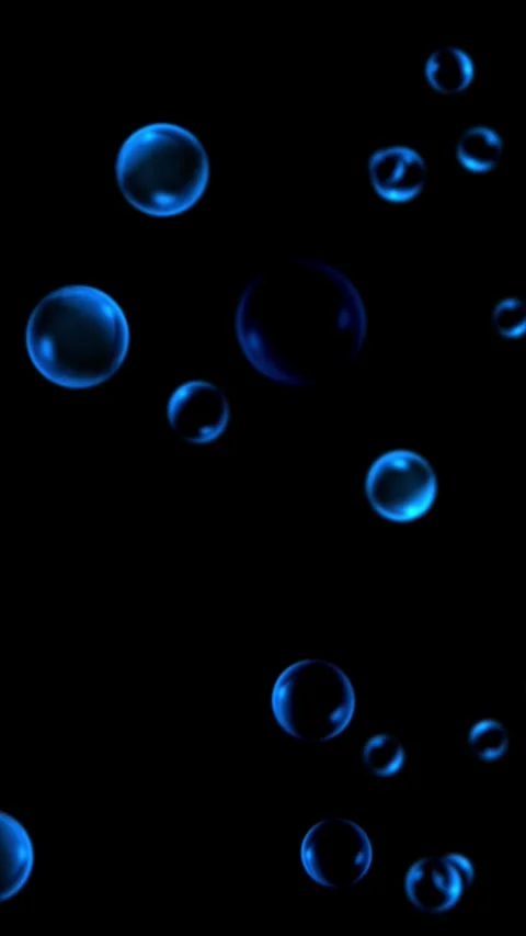 Blue bubbles float and drift on a black background, vertical format Stock Footage 340146645