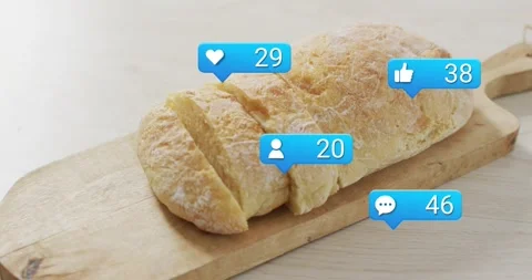 Blue bubbles starting single, appearing around sliced loaf on board, counters Stock Footage 323273494