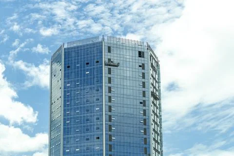 Blue building construction and elevator of worker blue sky and clouds backgro Stock Photos