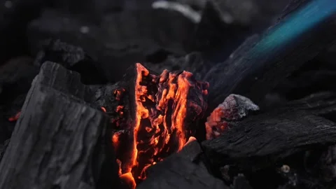 Blue burner flame igniting charcoal embers 動画素材 329914994