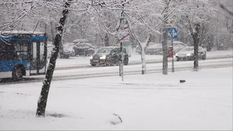 Blue bus on the snowy road Stock Footage 232811543