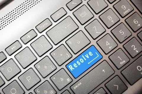 Blue button on the computer with the text Resolve Stock-Fotos