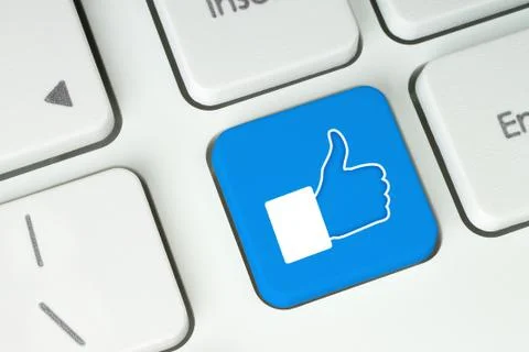 Blue like button on keyboard Stock Photos