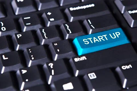 Blue button with text of start up Stock Photos