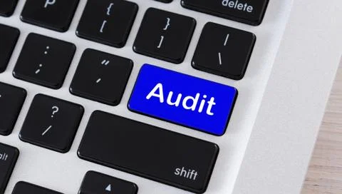 Blue button with word Audit on computer keypad Stock Photos