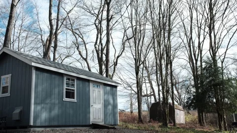 Blue cabin in the woods Stock Footage 291180292