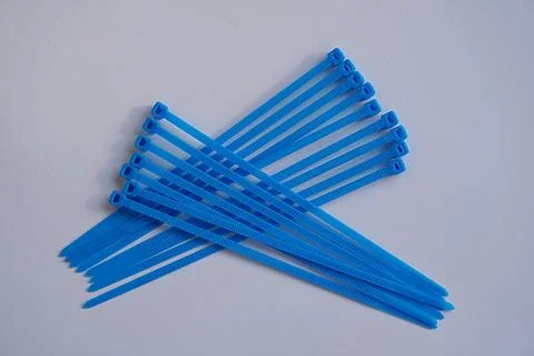 Blue cable tie, multipurpose fastener, job concept, bond strengthener 스톡 사진