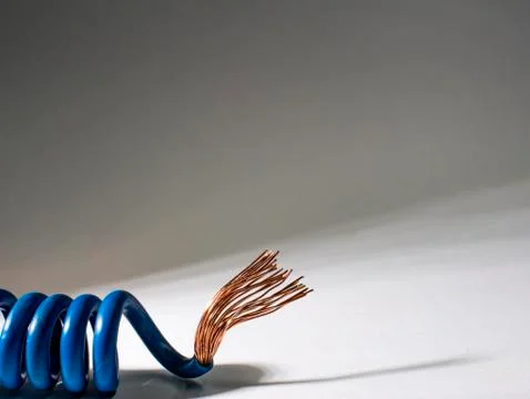 Blue cable twisted on white background.electrical insulated wire Foto stock