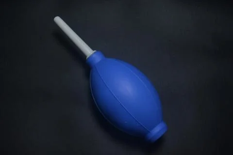 Blue camera lens blower, camera cleaning tool, isolated on black background Stock Photos