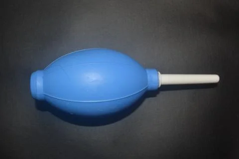 Blue camera lens blower, camera cleaning tool, isolated on black background Stock Photos