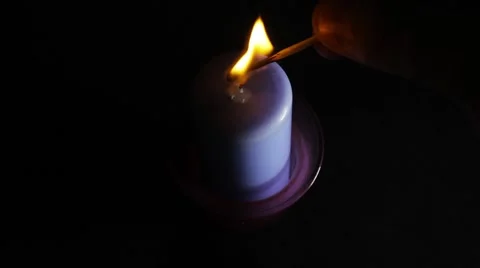 A blue candle on a black background Vidéo 53767551