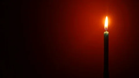Blue Candle in the night On Red Background Stock Footage 120734739