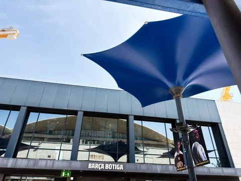 Blue canopy over Bara Botiga storefront at Camp Nou in Barcelona, Spain wit.. Stock Photos