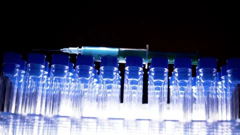 The blue cap test tubes on the racks inside the laboratory Foto stock
