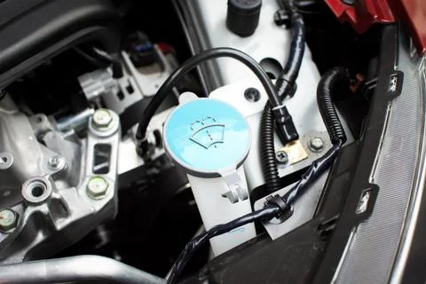 Blue cap of windscreen wiper fluid reservoir , windshield wiper reservoirr Stock Photos