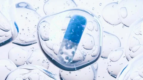 Blue Capsule Pill with Micro Particles Surrounded by Transparent Bubbles Stock Footage 315214330