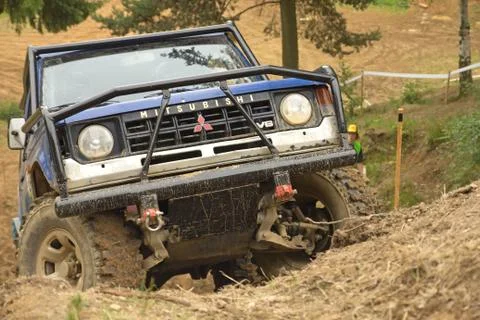 Blue car in difficult terrain Stock Photos