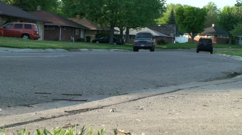 Blue car driving away from camera Stock Footage 701951