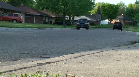 Blue Car driving down road Stock Footage 702457