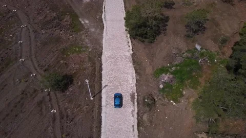 Blue car driving off road Stock Footage 195036880