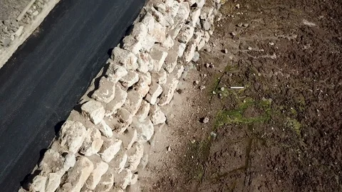 Blue car dryving on an empty mountain road TILT SHOT Stock Footage 88153723
