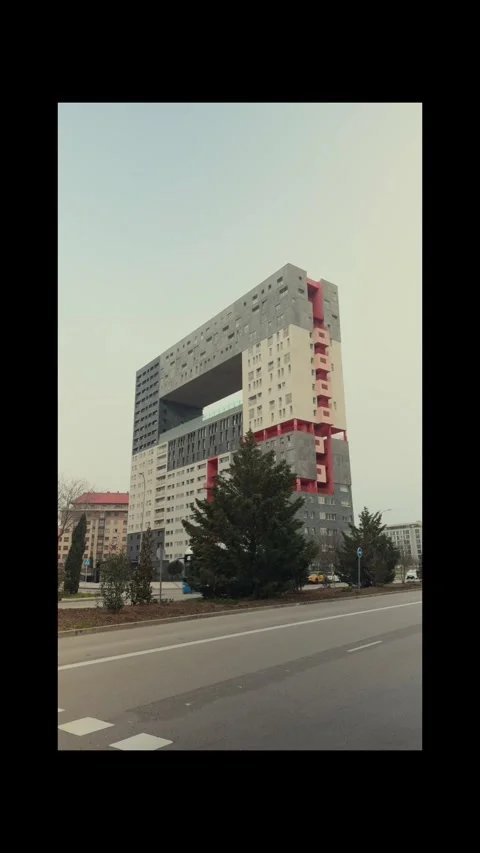 Blue car passing by a modern building Video stock 303087053
