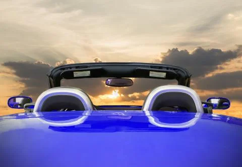 The blue car with sunset Stock Photos