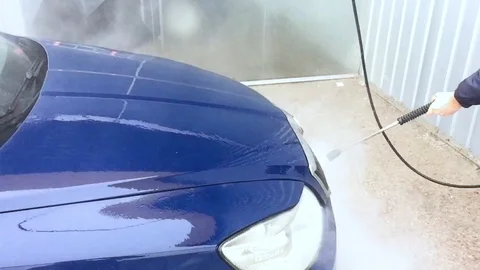 Blue car wash using high pressure water jet. Stock Footage 87323391