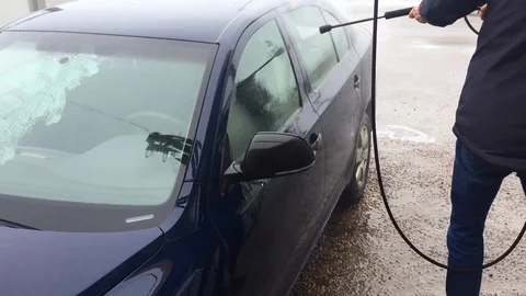 Blue car wash using high pressure water jet. Stock Footage 87323630