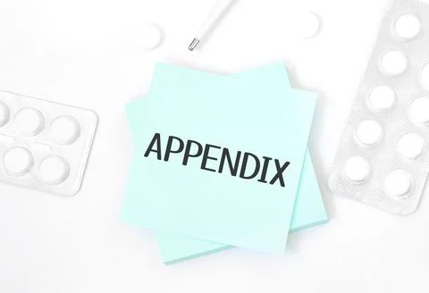 Blue card with text APPENDIX on a table with a pills and pencil, medical conc Stock Photos