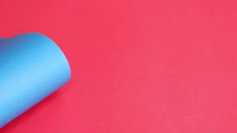 Blue cardboard moves over a red background. The texture of the cardboard. Stock Footage 157181769