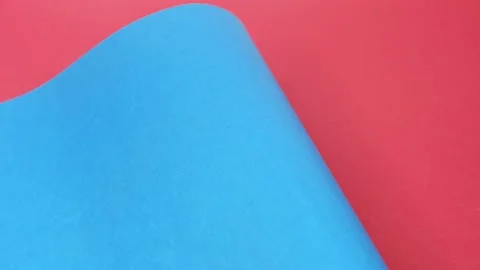 Blue cardboard on an orange background. The texture of the cardboard. 4k Stock Footage 160055143