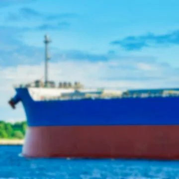 Blue cargo ship - blurred image Stockfoto's