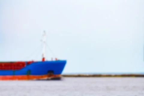 Blue cargo ship - blurred image Stockfoto's