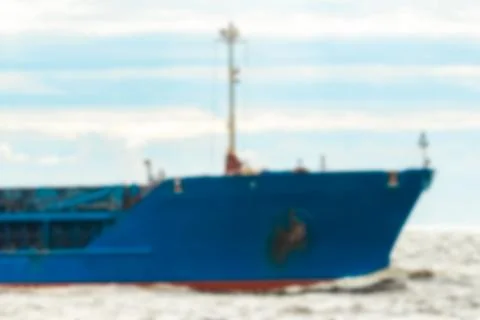 Blue cargo ship - blurred image Stock Photos