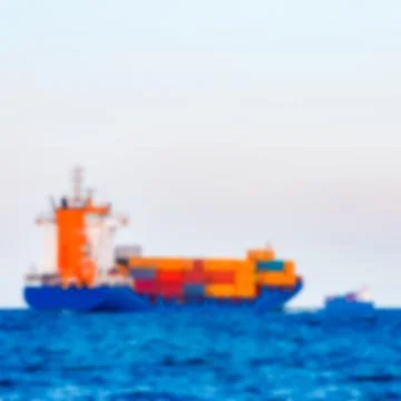 Blue cargo ship - blurred image 写真素材