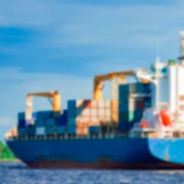 Blue cargo ship - blurred image Stockfoto's