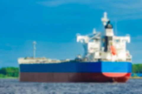 Blue cargo ship - blurred image Stockfoto's