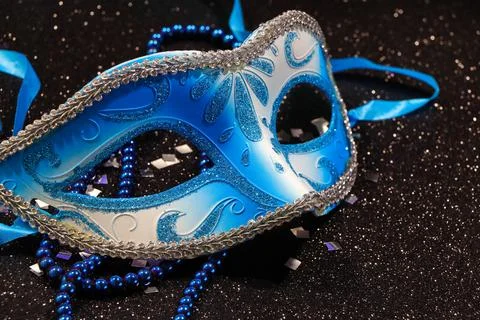 Blue Carnival Mask With Bead String And Confetti Stock-Fotos