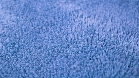 Blue Carpet fabric rotating pattern macro texture background backdrop footage Stock Footage 91381493