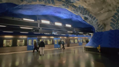 Blue cave art platform and train at T-Centralen metro station in Stockholm Stock Footage 340275949