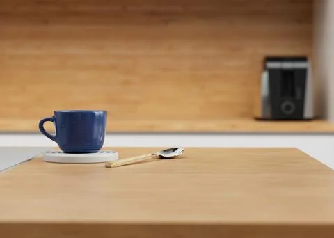 Blue Ceramic 3D Rendered Coffee Cup on Trivet with Spoon In Kitchen. Stock Photos