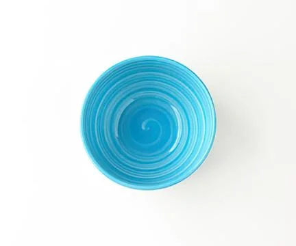 Blue ceramic bowl with smooth waves design Stock Photos