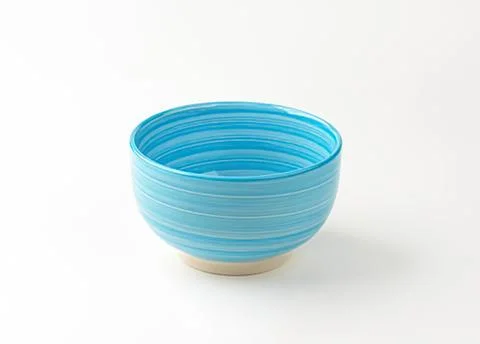 Blue ceramic bowl with striped pattern Stock Photos