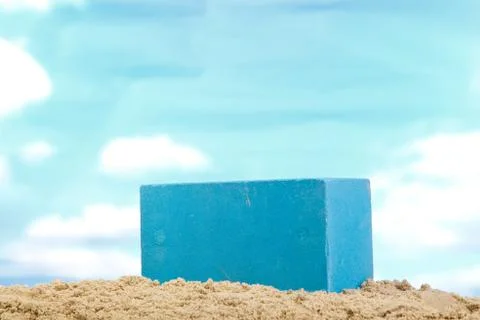 Blue ceramic bricks on the sand at the blue sky background Stock Photos