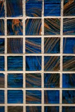 Blue ceramic mosaic on the wall as background Stock Photos