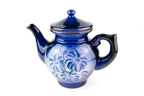 Blue ceramic teapot on a white background. Stock Photos