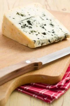 Blue cheese on kitchen table Stock Photos